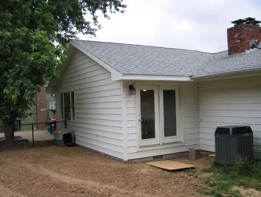 Home addition by C.B.E. Construction with new siding and a finished roofline tie in to the existing house